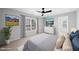 Calm and serene bedroom with a fan, neutral colors, neutral carpet, and plenty of natural light at 7707 Oak Marsh Dr, Raleigh, NC 27616