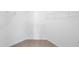 An organized walk-in closet with white shelving, providing ample storage space for clothes and accessories at 7707 Oak Marsh Dr, Raleigh, NC 27616