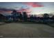 Expansive aerial view showcases a serene residential community amidst lush landscapes at dusk at 8005 Woodcross Way, Wake Forest, NC 27587