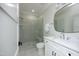 Modern bathroom with glass shower, white vanity, and sleek fixtures, offering a clean and bright space at 8005 Woodcross Way, Wake Forest, NC 27587