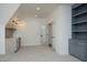 A bonus room featuring a wet bar, built in shelving and ample space for entertaining at 8005 Woodcross Way, Wake Forest, NC 27587