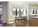 Sunlit breakfast nook with a bay window, built-in bench, and charming dining set creates a cozy ambiance at 8005 Woodcross Way, Wake Forest, NC 27587