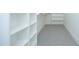 Well-organized walk-in closet with ample shelving, providing efficient storage and easy access to belongings at 8005 Woodcross Way, Wake Forest, NC 27587