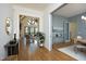Spacious foyer view leading into the home's living and dining areas with hardwood floors at 8005 Woodcross Way, Wake Forest, NC 27587