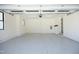 Clean and spacious garage with epoxy flooring and ample lighting, ideal for parking and storage solutions at 8005 Woodcross Way, Wake Forest, NC 27587