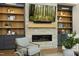 Cozy living room showcases a stone fireplace, built-in shelves, and comfortable seating for relaxation at 8005 Woodcross Way, Wake Forest, NC 27587