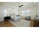 A serene main bedroom with tray ceilings, plantation shutters, and a seating area creates a peaceful retreat at 8005 Woodcross Way, Wake Forest, NC 27587
