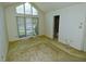 Bedroom features a large window, neutral walls, and ample natural light at 8008 Grey Oak Dr, Raleigh, NC 27615