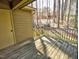 Exterior shot of a wooden deck next to a storage closet and surrounded by trees at 8008 Grey Oak Dr, Raleigh, NC 27615