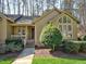 Charming single-story home featuring a well-manicured lawn and inviting front entrance at 8008 Grey Oak Dr, Raleigh, NC 27615