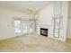 Spacious living room with a fireplace and lots of natural light from the doors and windows at 8008 Grey Oak Dr, Raleigh, NC 27615
