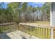 Backyard view from deck with grassy area surrounded by trees and blue sky at 808 Cross Link Dr, Angier, NC 27501