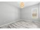 Sunlit bedroom boasting marble-style floors, neutral walls, and modern lighting at 808 Cross Link Dr, Angier, NC 27501