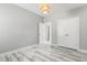 Bedroom featuring neutral walls, marble-style floors, and modern lighting fixture at 808 Cross Link Dr, Angier, NC 27501