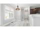 Cozy breakfast nook with a window, modern flooring, and a view of the kitchen at 808 Cross Link Dr, Angier, NC 27501