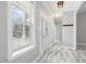 Bright foyer with marble tile flooring, a decorative front door, and natural light at 808 Cross Link Dr, Angier, NC 27501