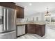Kitchen featuring dark wood cabinets, stainless steel appliances, and granite countertops at 808 Cross Link Dr, Angier, NC 27501