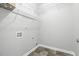 Neutral-toned laundry room featuring storage shelves and washer/dryer hookups at 808 Cross Link Dr, Angier, NC 27501