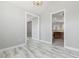 Bright living room leading into a modern kitchen with dark wood cabinets and granite countertops at 808 Cross Link Dr, Angier, NC 27501