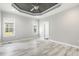Spacious main bedroom featuring a trey ceiling, ceiling fan, and abundant natural light at 808 Cross Link Dr, Angier, NC 27501