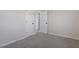 A cozy bedroom with fresh paint, neutral carpet and updated doors at 8215 S Nc 119 Hwy, Mebane, NC 27302