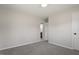 This bedroom is carpeted and freshly painted with an ensuite bathroom at 8215 S Nc 119 Hwy, Mebane, NC 27302