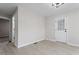 Bright living room with luxury vinyl plank flooring and ample natural light from the door and windows at 8215 S Nc 119 Hwy, Mebane, NC 27302