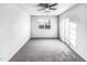 Bright, airy bedroom featuring neutral walls, carpet, and a large window at 101 Adams Peak Ln, Garner, NC 27529