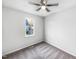 Clean, well-lit bedroom with neutral walls, carpet, and a window overlooking the neighborhood at 101 Adams Peak Ln, Garner, NC 27529
