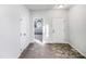 Inviting foyer with neutral carpet and flooring, showcasing multiple doorways and natural light at 101 Adams Peak Ln, Garner, NC 27529