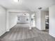 Spacious living area featuring new carpet, large windows and an open-concept design at 101 Adams Peak Ln, Garner, NC 27529