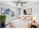 Cozy staged bedroom featuring a comfortable bed, modern decor, and natural light at 101 Adams Peak Ln, Garner, NC 27529