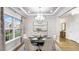 Inviting dining room featuring natural light, a stylish chandelier, and comfortable seating for Gathering gatherings at 1010 Red Roses Ave, Durham, NC 27703