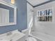 Bathroom featuring a vanity with sink, toilet and a shower-tub combo with tiled surround at 1017 E Club Blvd, Durham, NC 27704