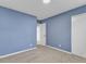 Bright bedroom showcasing neutral carpet and a large closet for ample storage solutions at 1017 E Club Blvd, Durham, NC 27704