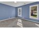 Bedroom boasts ample natural light and plush carpeting at 1017 E Club Blvd, Durham, NC 27704