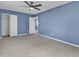 Spacious bedroom with neutral carpet and white closet doors at 1017 E Club Blvd, Durham, NC 27704