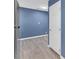 Hallway features wood-look floors, white door, and recessed lighting at 1017 E Club Blvd, Durham, NC 27704