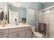 Stylish bathroom featuring modern fixtures, vanity with sink and a walk-in shower at 1040 Lippincott Rd, Durham, NC 27703