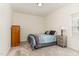 Comfortable bedroom with neutral tones, plush carpet, and ample natural light at 1040 Lippincott Rd, Durham, NC 27703