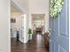 Inviting foyer with dark wood flooring, view to a naturally lit office, and a view into the living room at 1040 Lippincott Rd, Durham, NC 27703