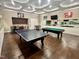 Spacious game room featuring a ping pong table, pool table, and entertainment area at 1040 Lippincott Rd, Durham, NC 27703