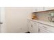 Charming kitchen features white cabinets, granite countertops, and stainless steel appliances at 1040 Lippincott Rd, Durham, NC 27703