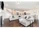 Open-concept living room showcases sleek floors, a modern fireplace, and seamlessly connects to the kitchen at 1040 Lippincott Rd, Durham, NC 27703