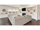 Bright living room features a contemporary fireplace, built in shelving, and large windows at 1040 Lippincott Rd, Durham, NC 27703