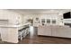 Open concept kitchen and living room with stainless steel appliances and modern decor at 1040 Lippincott Rd, Durham, NC 27703