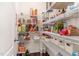 Walk-in pantry with white wire shelving and plenty of storage space for food and supplies at 1040 Lippincott Rd, Durham, NC 27703