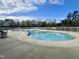 A sparkling outdoor community pool with a surrounding fence and seating area at 1040 Lippincott Rd, Durham, NC 27703