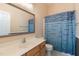 Bathroom with a single sink vanity, and a shower/tub with mosaic curtain at 106 Madison Square Ln, Cary, NC 27513