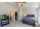 Comfortable bedroom with bed, desk, and en-suite access at 106 Madison Square Ln, Cary, NC 27513